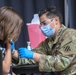 U.S. Army Spc. Rosado vaccinates teenager at the Atlanta CVC