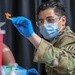 U.S. Army Spc. Rosado vaccinates teenager at the Atlanta CVC
