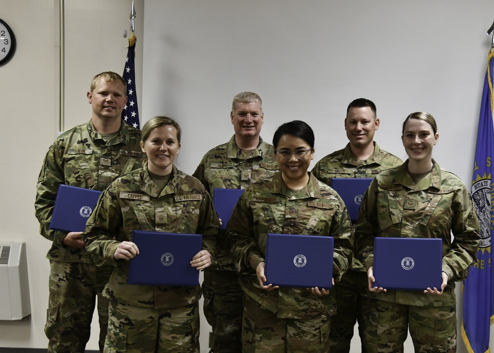 Members of the 114th Fighter Wing graduate from the Community College of the Air Force