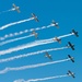 A formation of civilian single engine aircraft fly overhead during the Sound of Speed Airshow