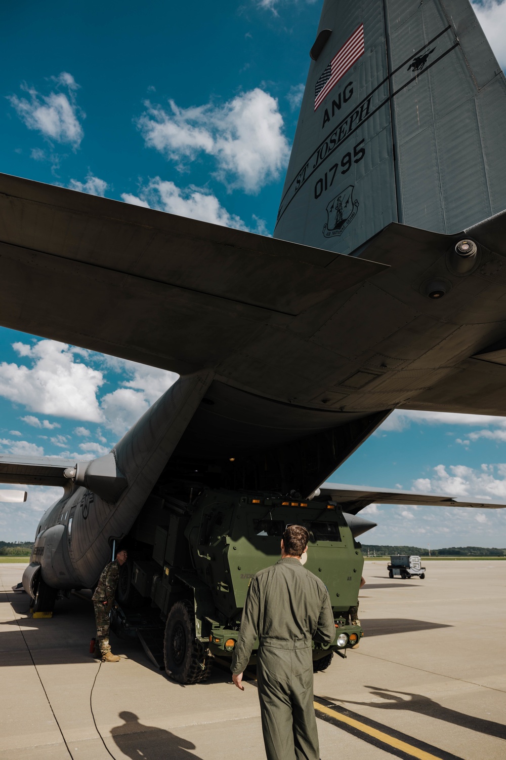 Airmen load a High Mobility Artillery Rocket System onto a C-130 Hercules