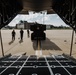 Airmen load a High Mobility Artillery Rocket System onto a C-130 Hercules