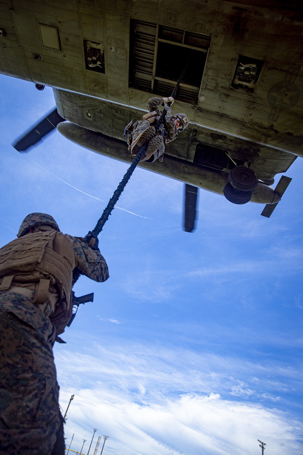 US Marines with Maritime Raid Force fast rope off a CH-53E Super Stallion and UH-1Y Venom Helicopter