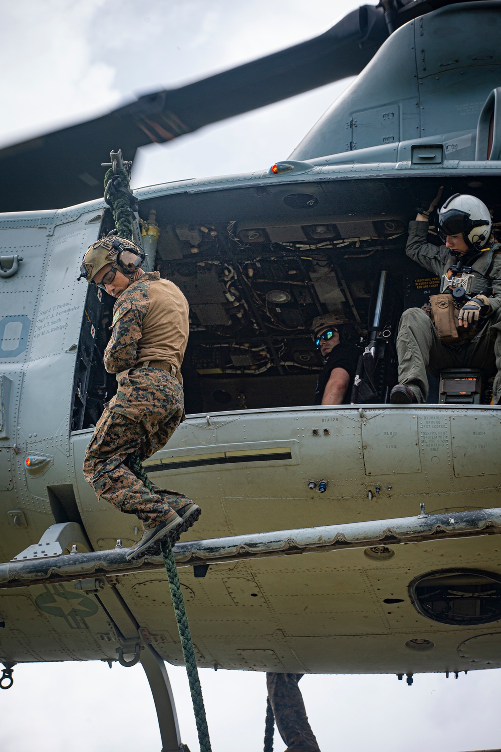 US Marines with Maritime Raid Force fast rope off a CH-53E Super Stallion and UH-1Y Venom Helicopter