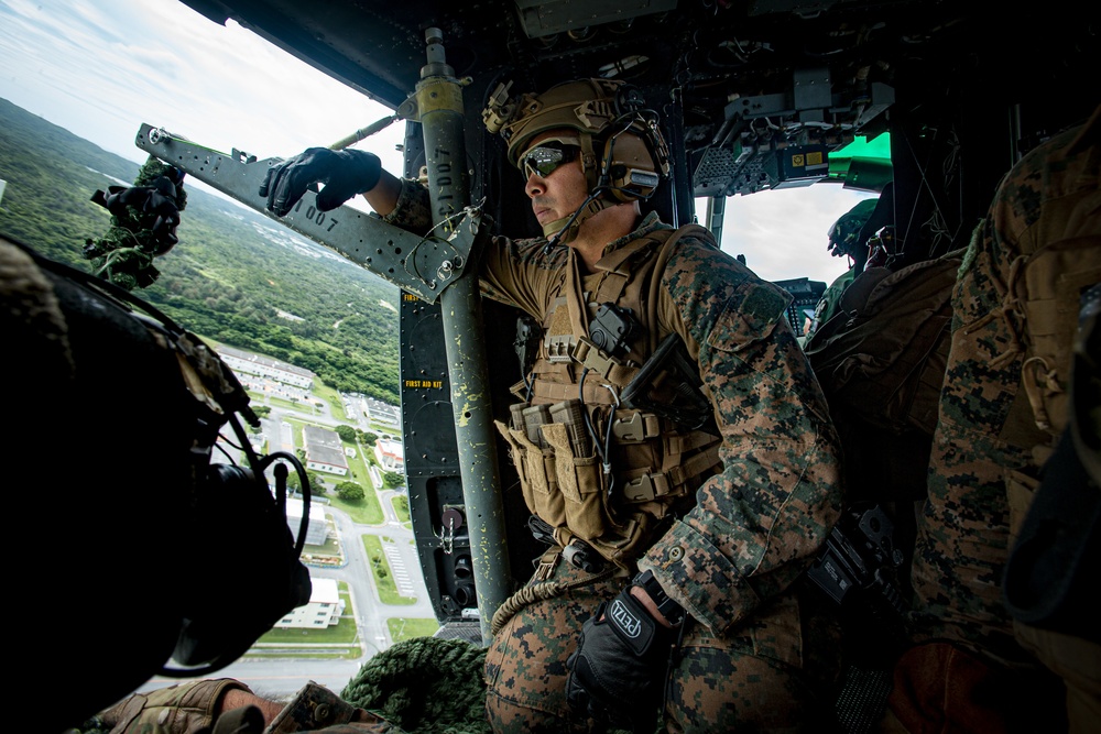 US Marines with Maritime Raid Force fast rope off a CH-53E Super Stallion and UH-1Y Venom Helicopter