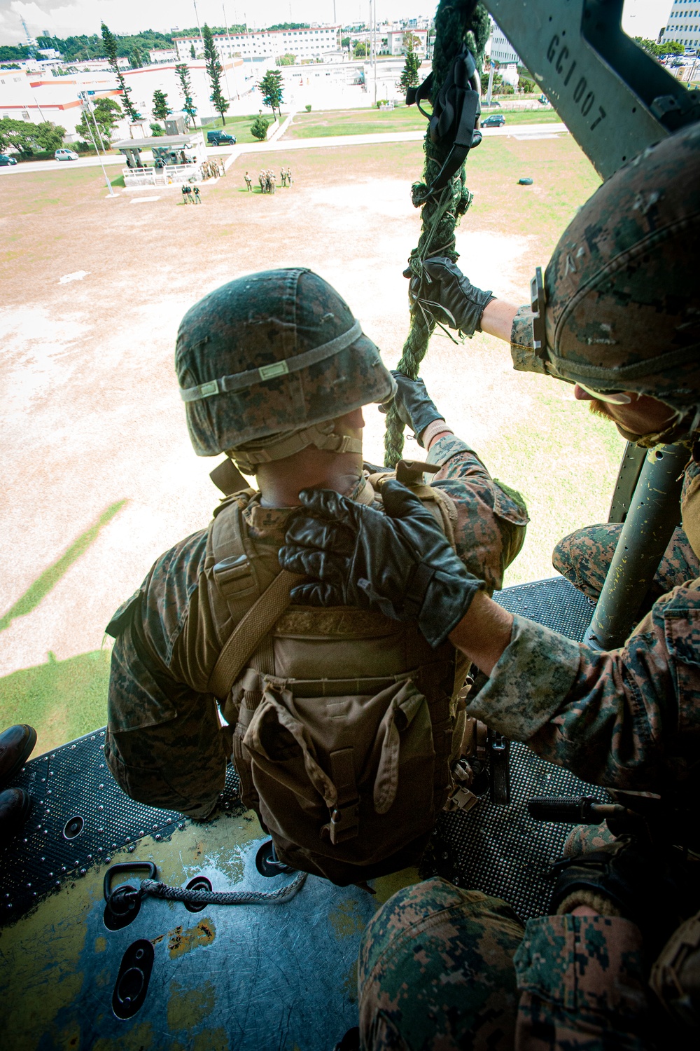 US Marines with Maritime Raid Force fast rope off a CH-53E Super Stallion and UH-1Y Venom Helicopter