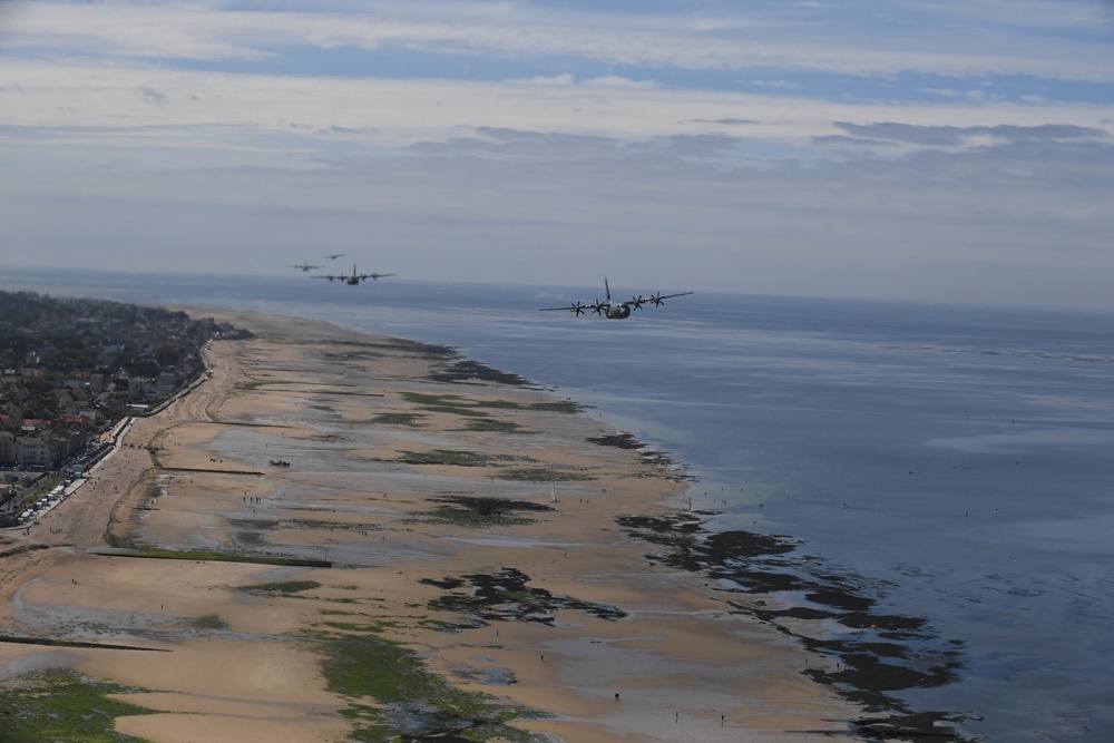 U.S. Air Force C-130js fly over Normandy to commemorate D-Day