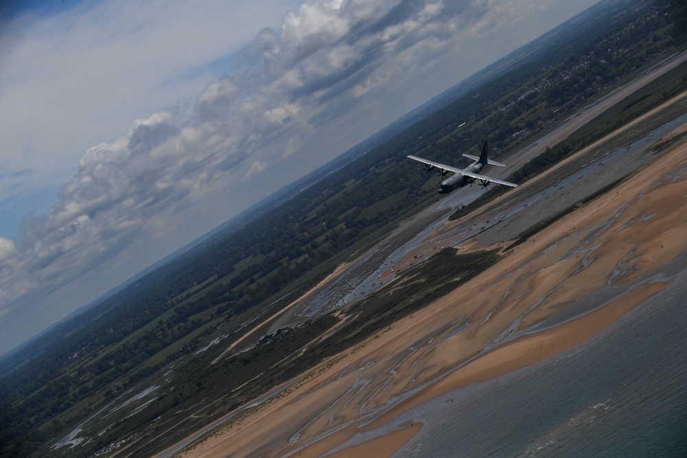 U.S. Air Force C-130js fly over Normandy to commemorate D-Day