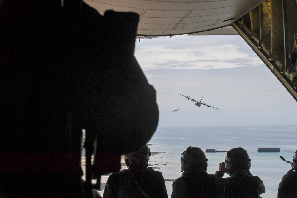 U.S. Air Force C-130js fly over Normandy to commemorate D-Day