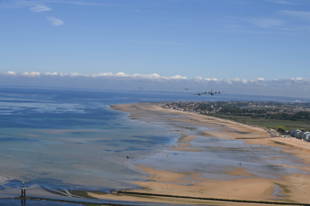 U.S. Air Force C-130js fly over Normandy to commemorate D-Day