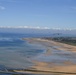 U.S. Air Force C-130js fly over Normandy to commemorate D-Day