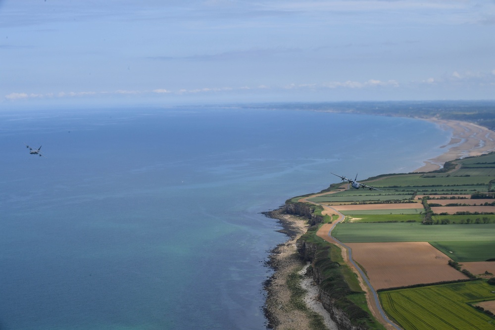 U.S. Air Force C-130js fly over Normandy to commemorate D-Day