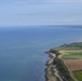 U.S. Air Force C-130js fly over Normandy to commemorate D-Day