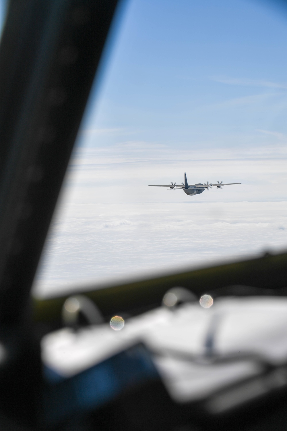 U.S. Air Force C-130js fly over Normandy to commemorate D-Day