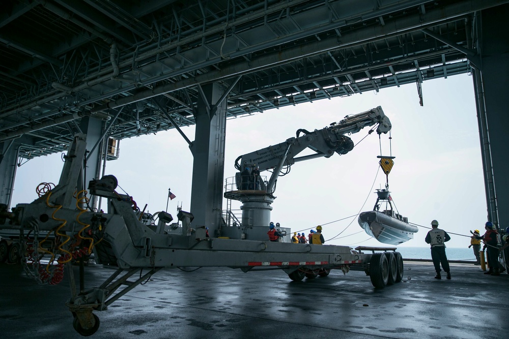 11M Naval Special Warfare Rigid Inflatable Boats arrive on USS Lewis B Puller