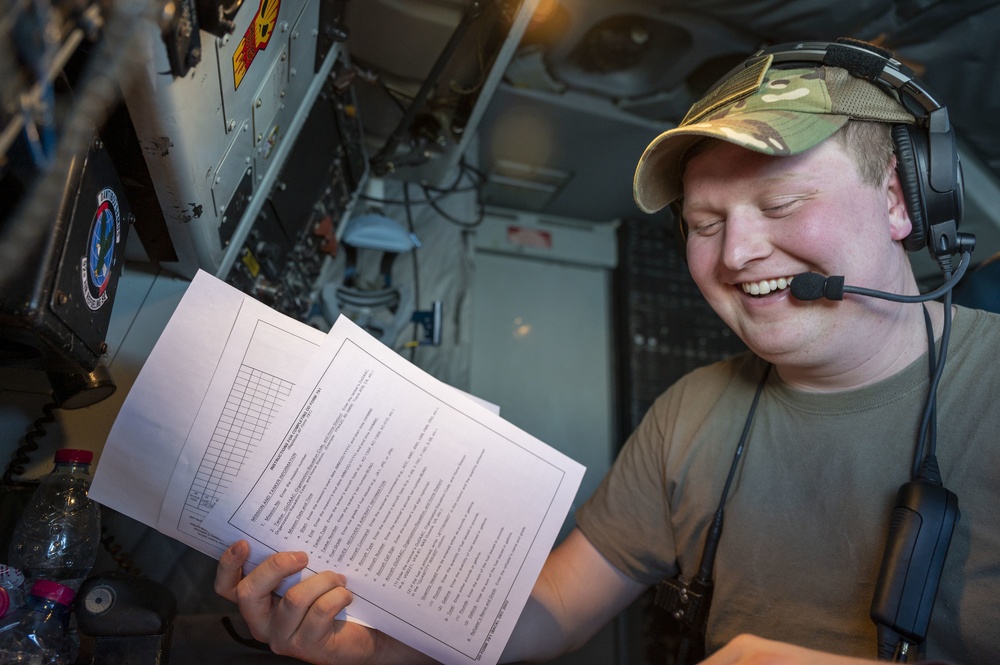 U.S. Air Force Inflight Refueling Specialist Reviews Flight Documents