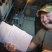 U.S. Air Force Inflight Refueling Specialist Reviews Flight Documents