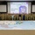 A large group of U.S. Army personnel and civilians pose for a group photo at the 2021 Hurricane ROC (Regional Operations Center) Drill held on June 3, 2021, organized by U.S. Army North (Fifth Army). The participants are standing behind a large floor map of the United States with tactical markers and unit designators placed across it. The event appears to be a military readiness exercise focused on hurricane response planning.