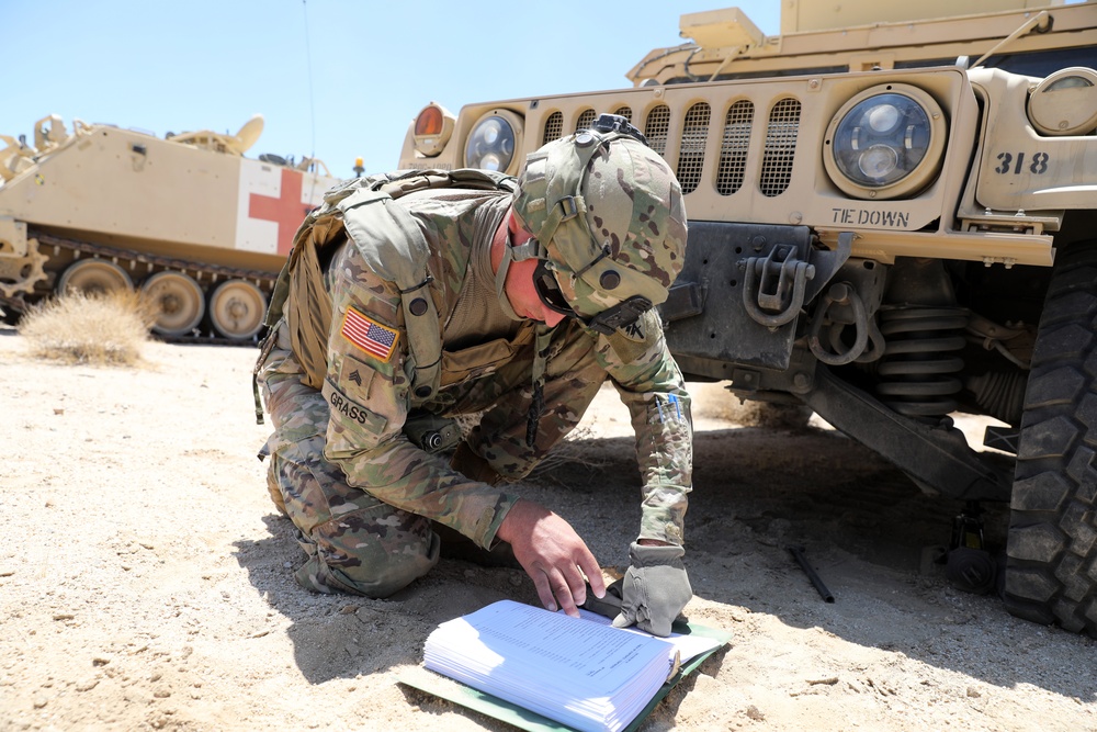 Soldier reading TM