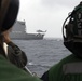 Sailors aboard USS Rafael Peralta (DDG 115) await a MH-60R Seahawk assigned to (HSM-51) during a vertical replenishment with USNS Pecos (T-AO-197)