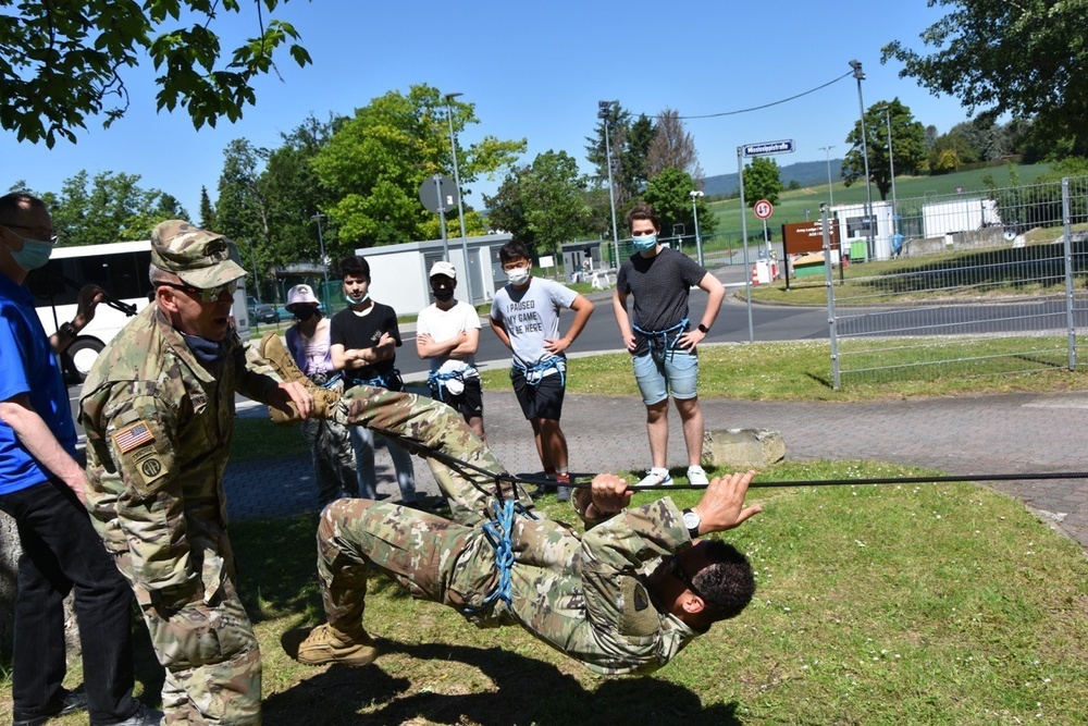 Garrison Commander joins in JROTC rope bridge team building event