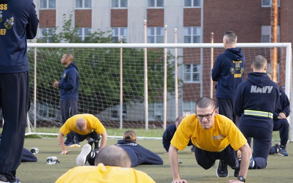 210602-N-WJ386-1037 NEWPORT, R.I. (June 2, 2021) Navy OCS class conducts PT test