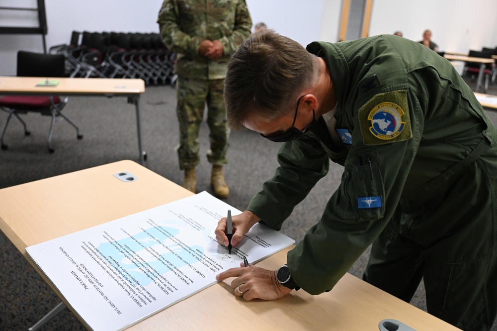 165th Airlift Wing leadership sign a Proclamation on National Sexual Assault Prevention And Awareness Month