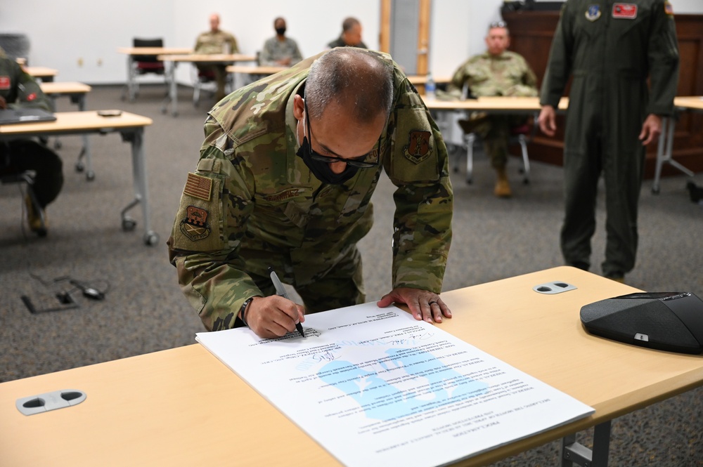 165th Airlift Wing leadership sign a Proclamation on National Sexual Assault Prevention And Awareness Month