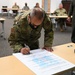 165th Airlift Wing leadership sign a Proclamation on National Sexual Assault Prevention And Awareness Month
