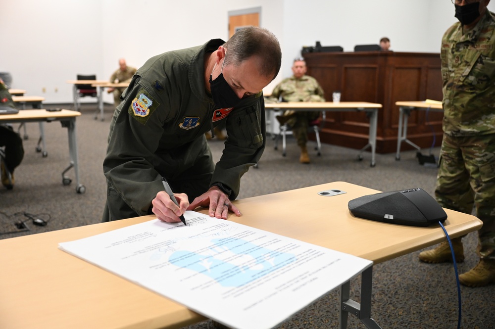 165th Airlift Wing leadership sign a Proclamation on National Sexual Assault Prevention And Awareness Month