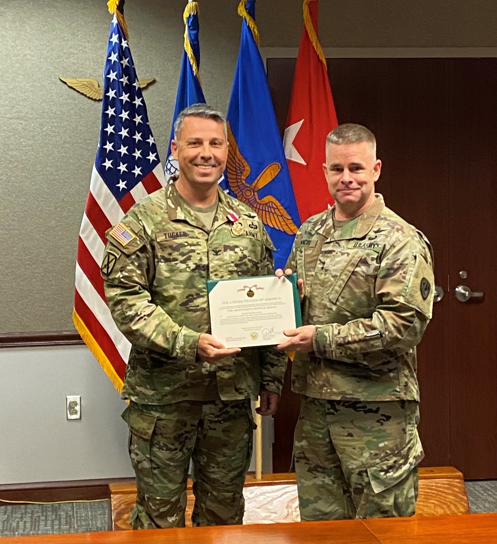 Tucker Recognized for Meritorious Service