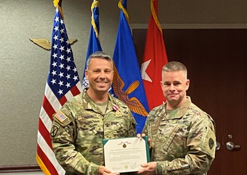 Tucker Recognized for Meritorious Service
