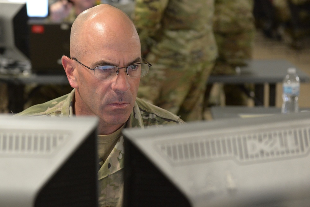 38th Infantry Division soldiers man their battle stations for 35th Infantry Division warfighter exercise