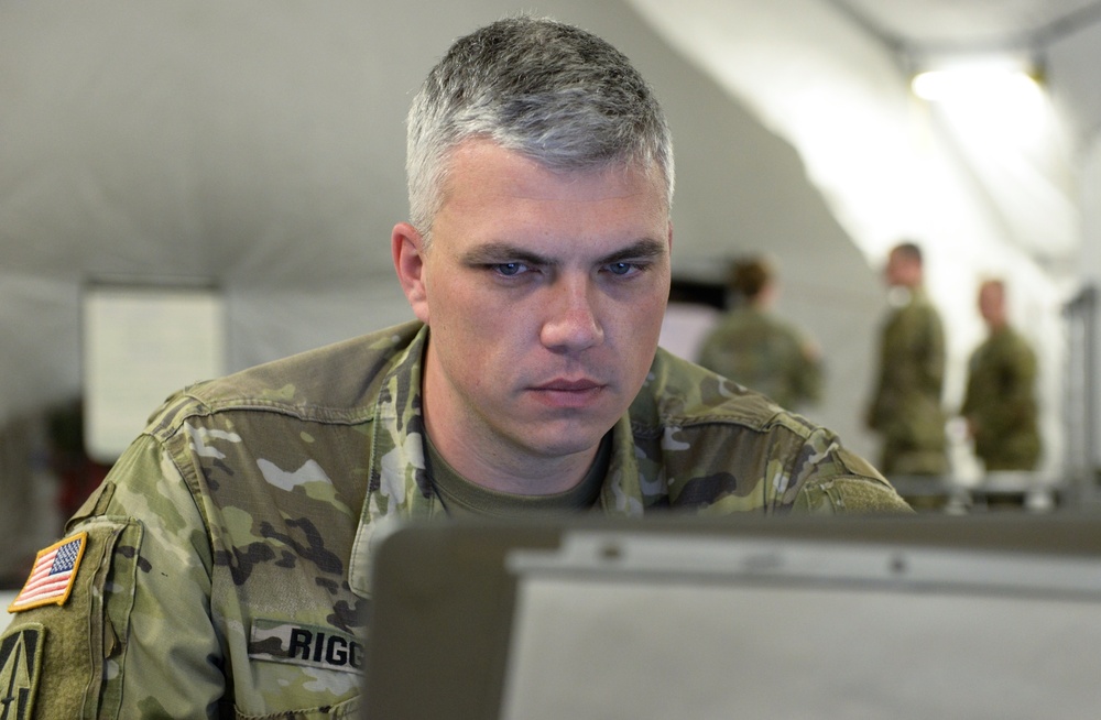 38th Infantry Division soldiers man their battle stations for 35th Infantry Division warfighter exercise