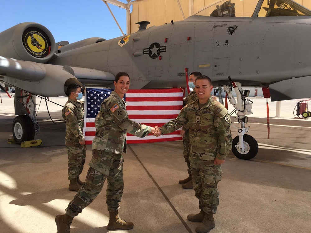 LTC McKaig congratulates Soldier on reenlistment