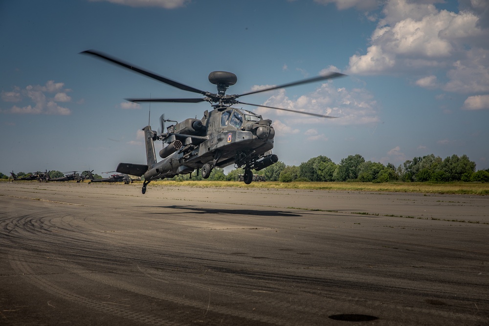 A AH-64D Apache returning from the Live Fire range