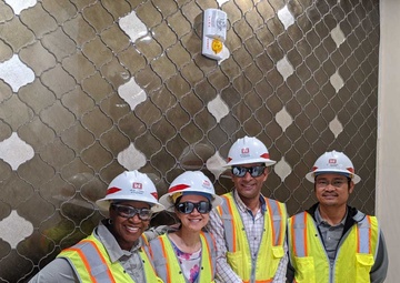 TAM PM Kim Sanders with team on site in Qatar