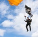 Parachutist displays POW/ MIA flag