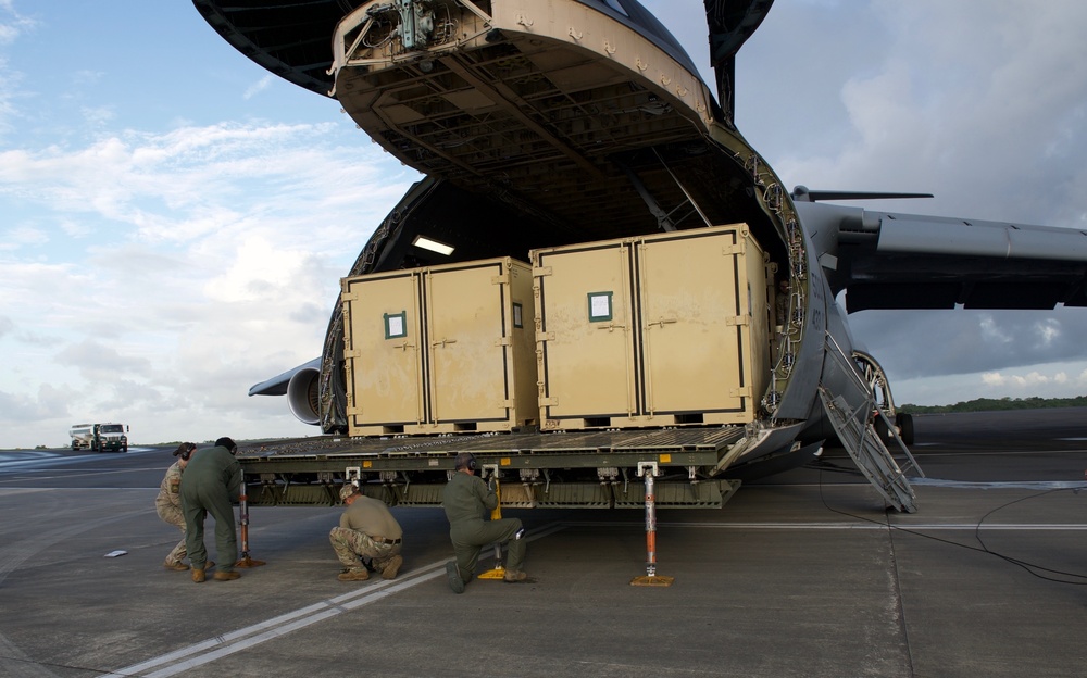 Members of the 185th Aviation Battalion from the Florida National Guard are getting ready to unload a C-5 Galaxy aircraft in Timehri, Guyana for the upcoming Exercise Tradewinds 2021