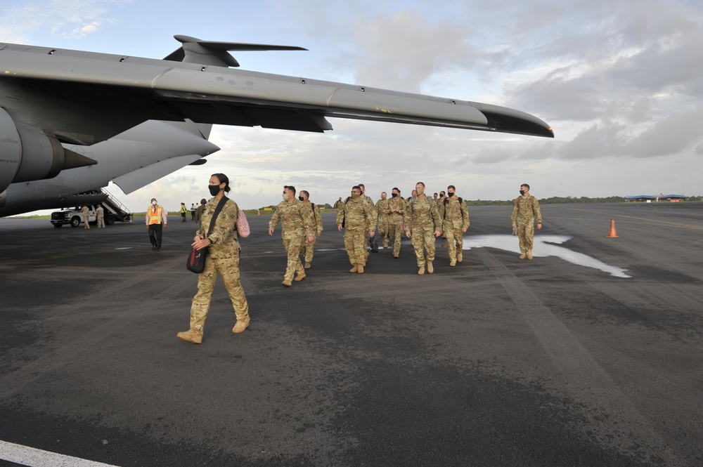 Members of the 185th Aviation Battalion from the Florida National Guard are getting off a C-5 Galaxy aircraft in Timehri, Guyana for the upcoming Exercise Tradewinds 2021