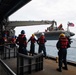 Sailors assigned to USS New Orleans (LPD 18) lower a rigid hull inflatable boat into the sea