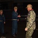 Rear Adm. Christopher Engdahl, commander, Expeditionary Strike Group 7/Task Force 76 greets Capt. Brian Schrum, commanding officer of USS New Orleans