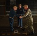 Rear Adm. Christopher Engdahl, commander, Expeditionary Strike Group 7/Task Force 76 greets Capt. Brian Schrum, commanding officer of USS New Orleans