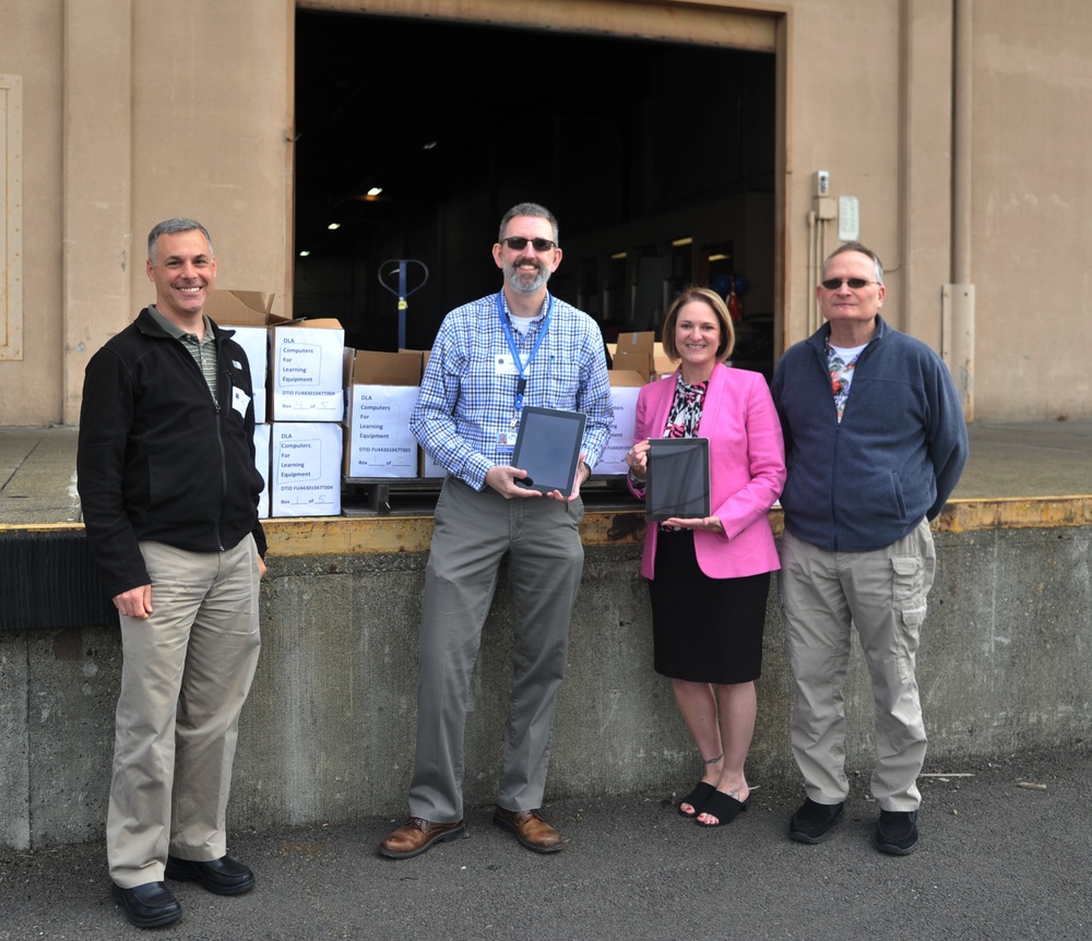 Local elementary schools receives 96 iPad tablets from 446th Operations Group