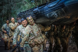 Sgt. 1st Class Mark Peralta carries Zodiac - 25th DIVARTY Senior NCO LPD “Thunder Stripes”