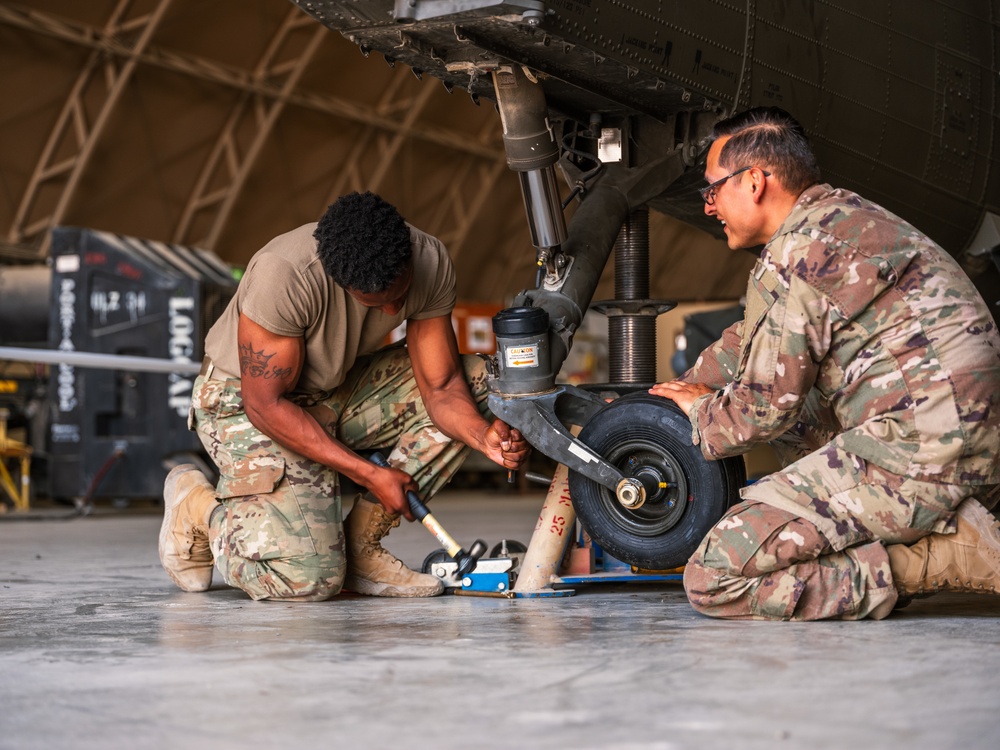 Task Force Phoenix Soldiers from the 640th ASB work on helicopters