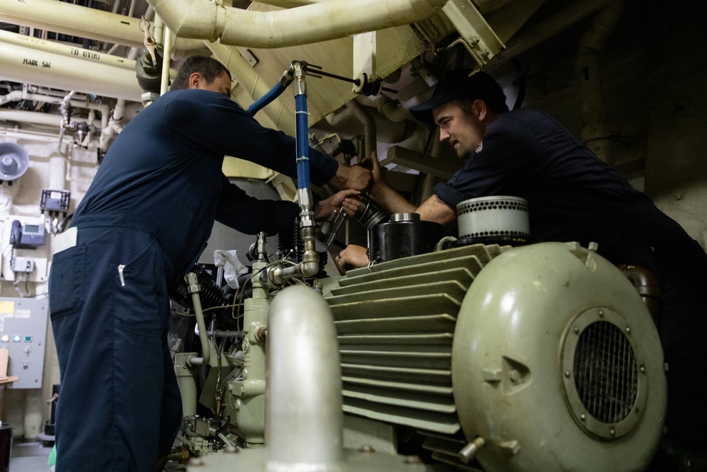 USS Sioux City Sailors Conduct Maintenance on Machinery While in Port