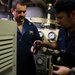 USS Sioux City Sailors Conduct Maintenance on Machinery While in Port