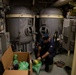 USS Sioux City Sailor Conducts Maintenance on Machinery While in Port