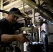 USS Sioux City Sailor Conducts Maintenance on Machinery While in Port